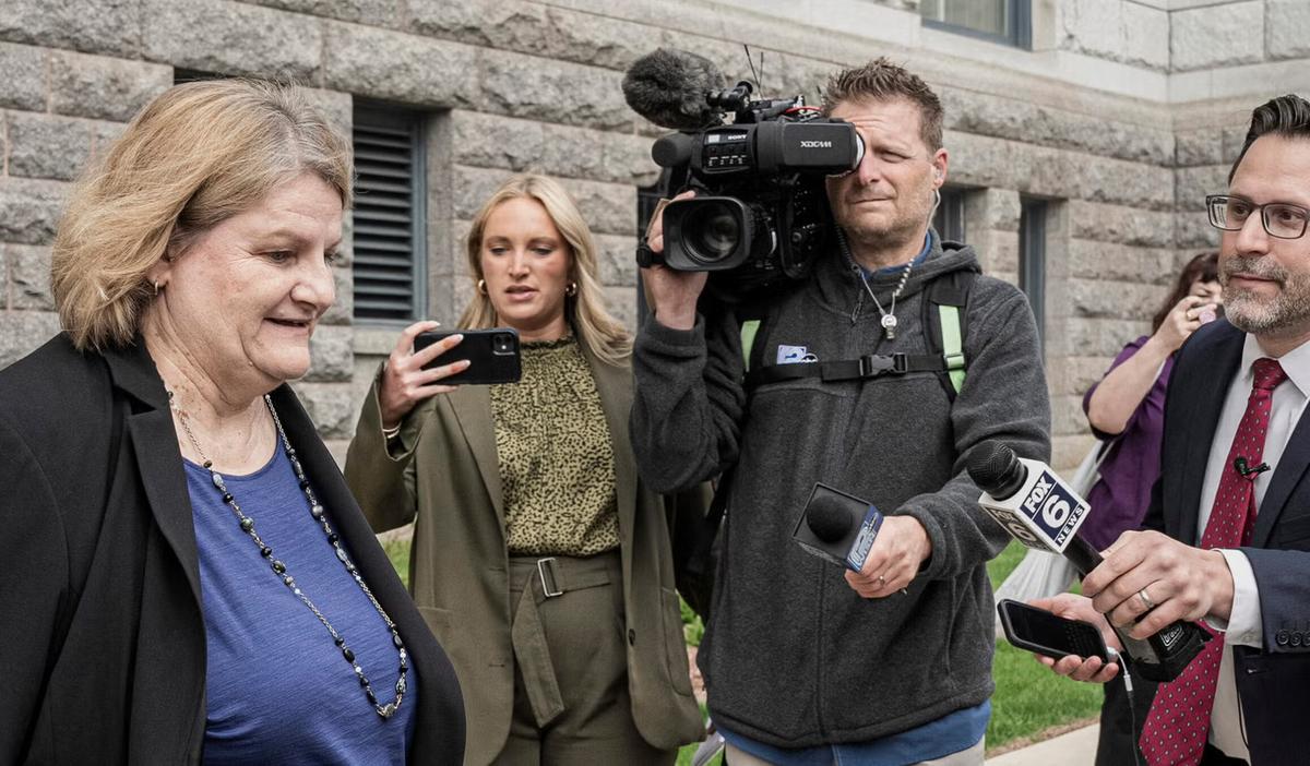 Judge Hannah Dugan arriving at federal courthouse surrounded by media, December 2025